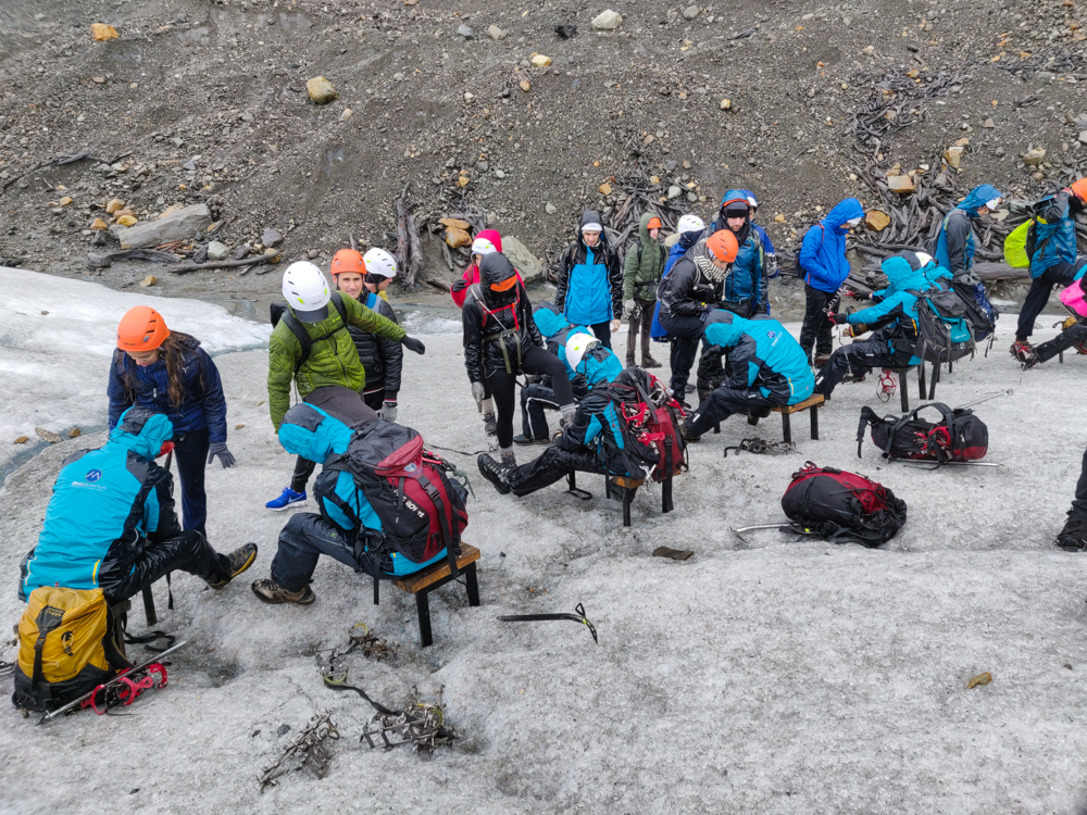 The group getting their crampons put on