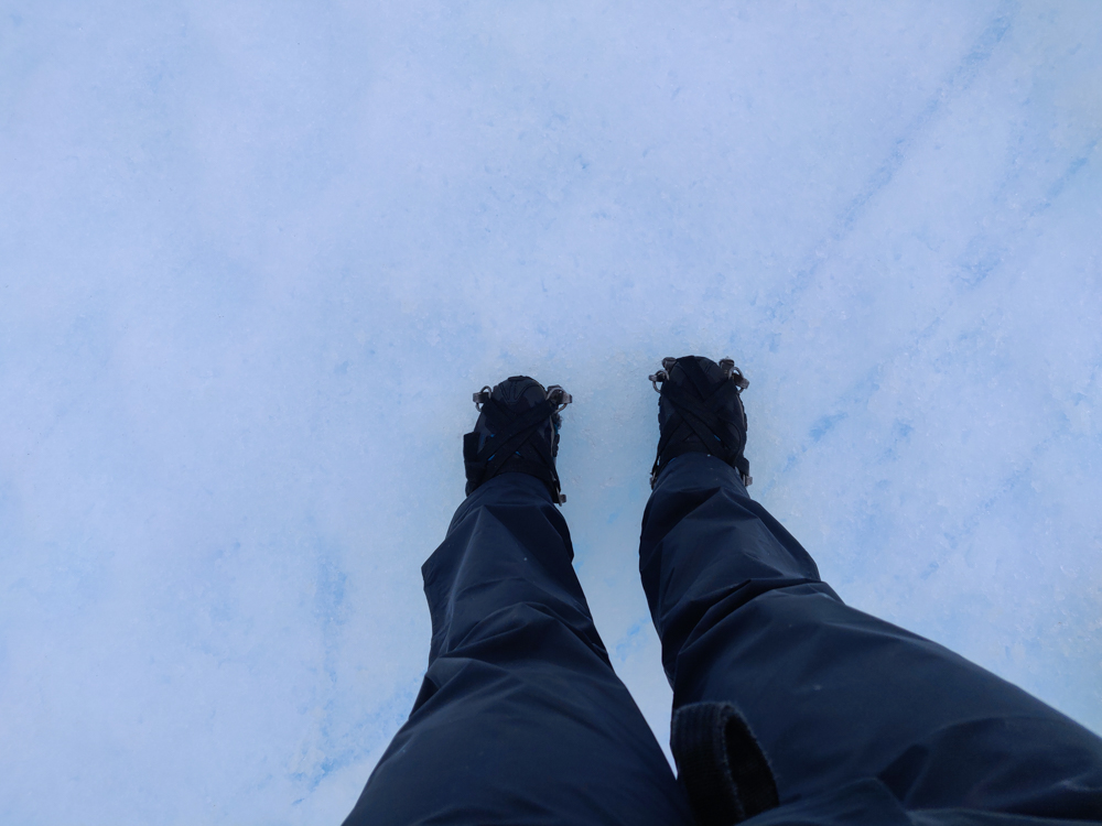 Looking down at my feet on the glacier