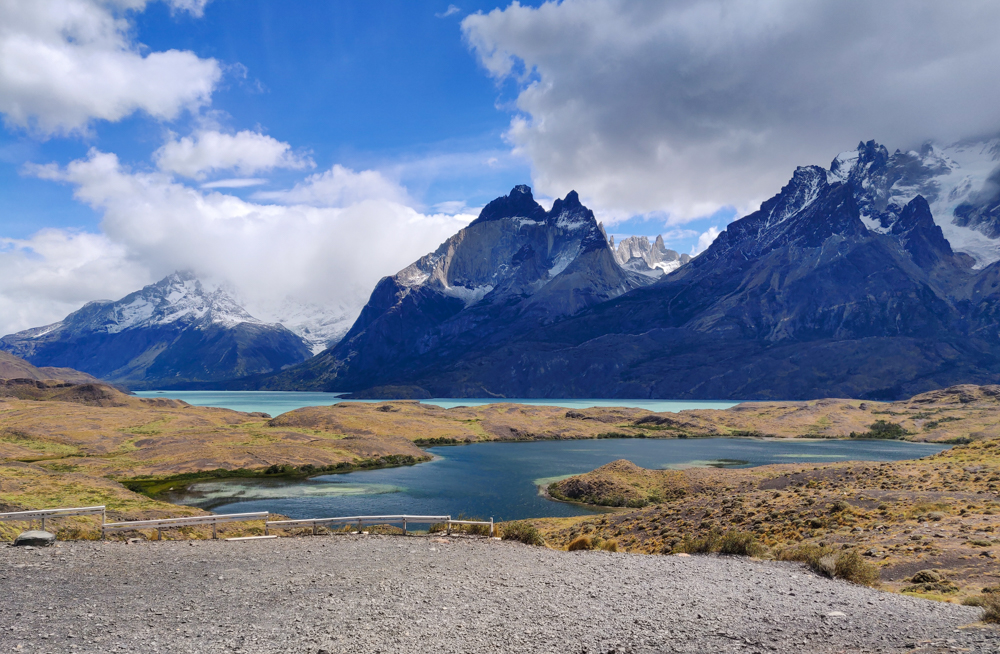 Blue lake with big mountains in the distance