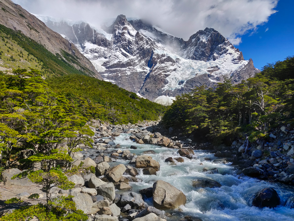 A river with mountains in the background