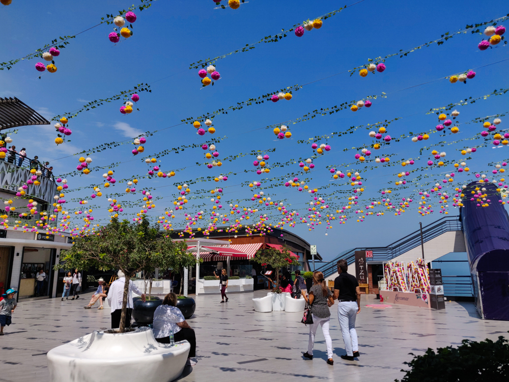 Flowers strung up across the sky at the mall