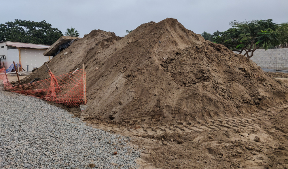 A giant pile of dirt from the foundation holes