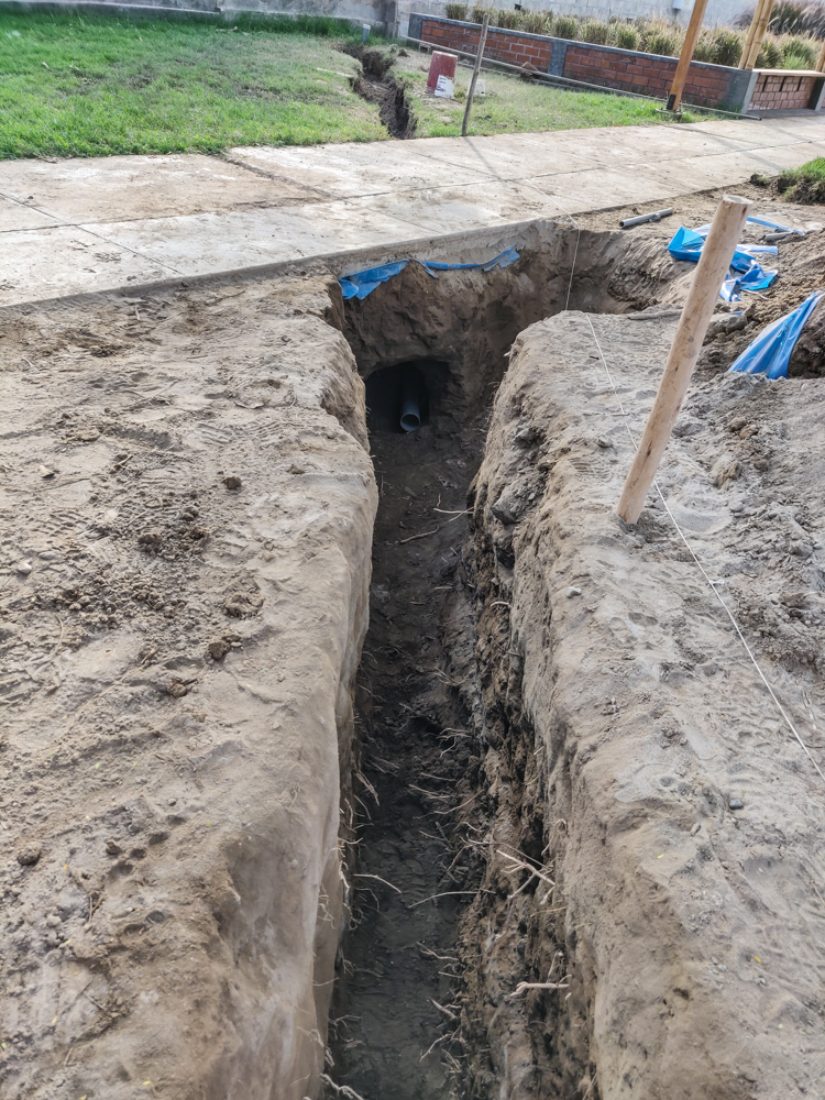 The trench and under-sidewalk tunnel