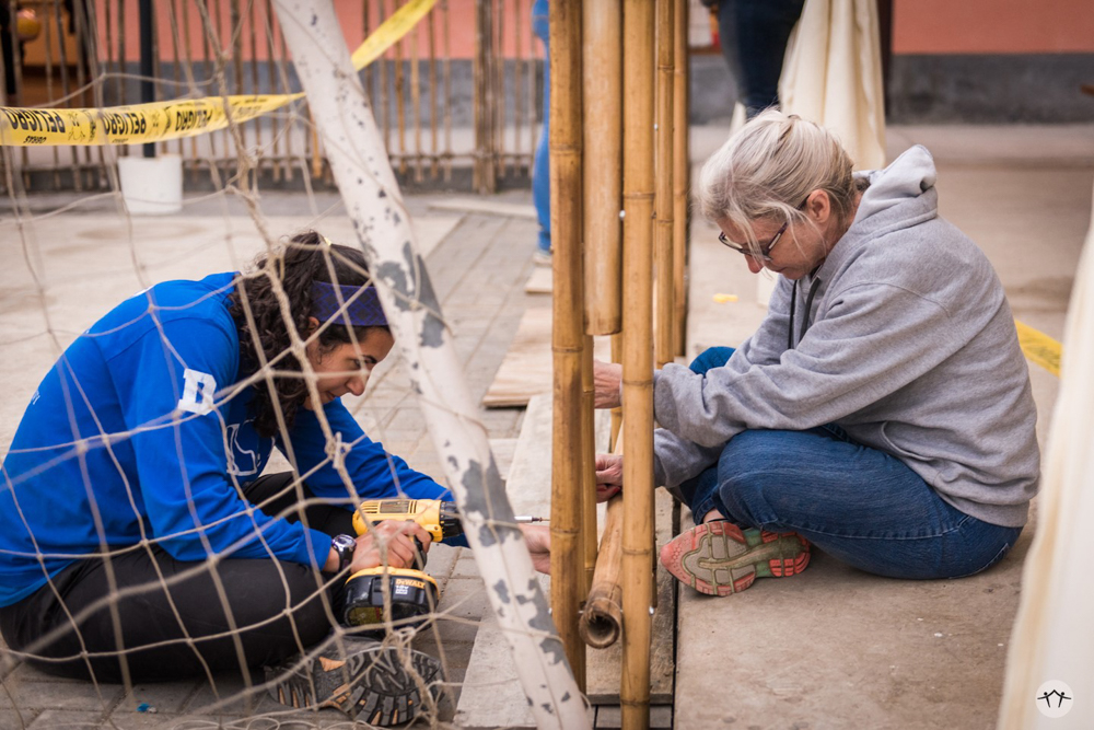 Me and a team member working on the fence