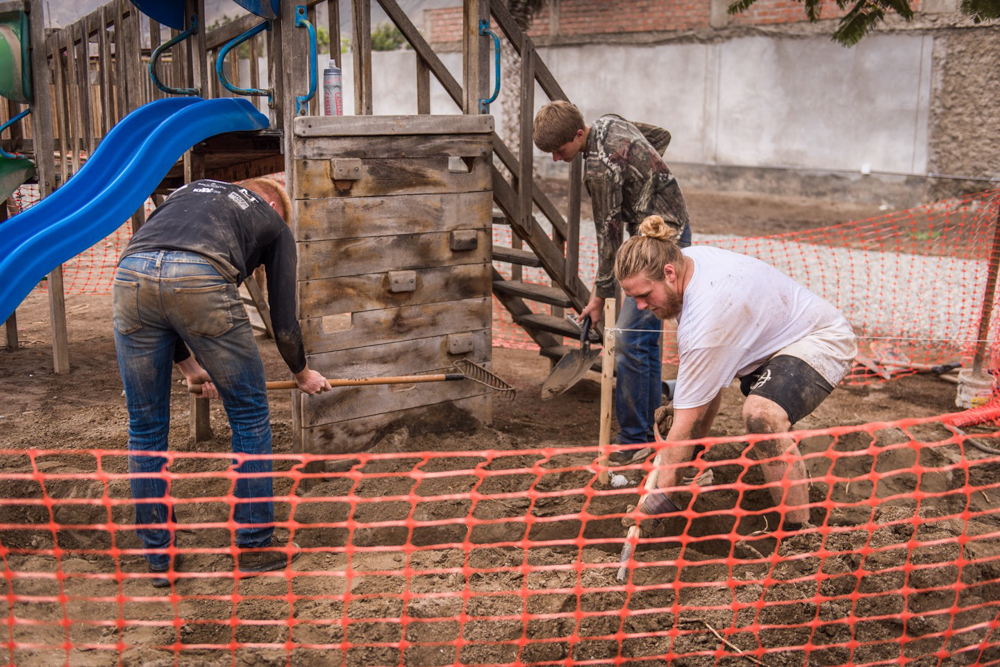 The three trench-digging guys working hard