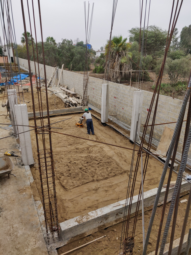 One of the construction workers leveling off the dirt in Module 1