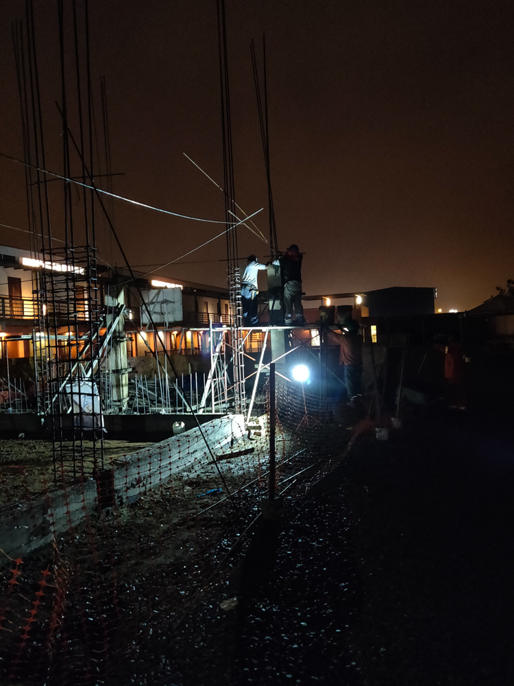 Pouring the concrete for a column in the dark