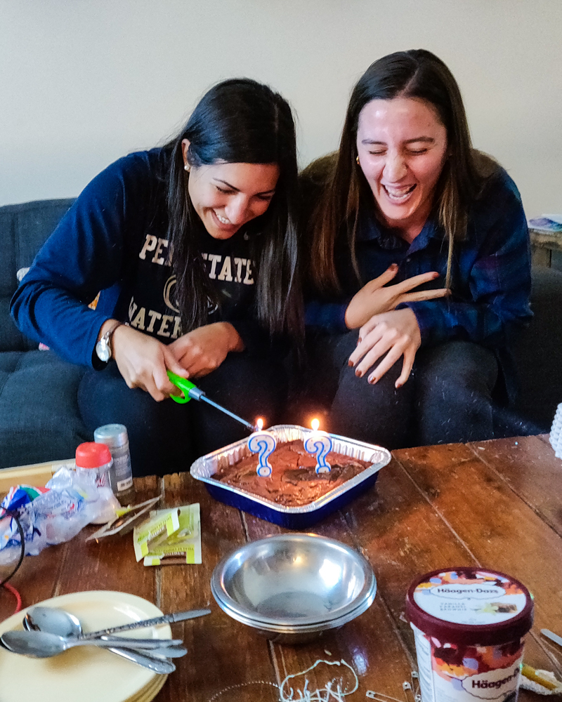 Me lighting the second candle on our birthday brownies